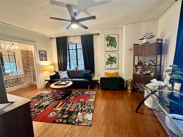 210 N 17th St W Unit 15, Bradenton, FL 34205 - living area with wood finished floors, ceiling fan, and a chandelier