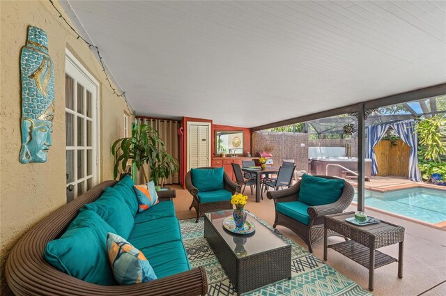 941 Virginia Dr, Sarasota, FL 34234 - view of patio / terrace with a hot tub, an outdoor living space, fence, and outdoor dining area