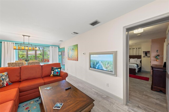 941 Virginia Dr, Sarasota, FL 34234 - living room with light wood-type flooring and baseboards