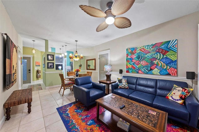 941 Virginia Dr, Sarasota, FL 34234 - living area featuring a ceiling fan, light tile patterned floors, a chandelier, and baseboards
