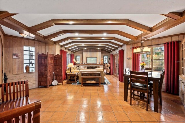 941 Virginia Dr, Sarasota, FL 34234 - bedroom featuring wood walls and light tile patterned floors