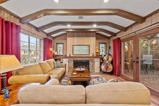 941 Virginia Dr, Sarasota, FL 34234 - living room with wood finished floors, wooden walls, and a tiled fireplace