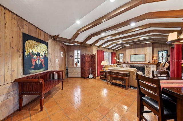 941 Virginia Dr, Sarasota, FL 34234 - foyer entrance featuring wooden walls, light tile patterned floors, and a fireplace