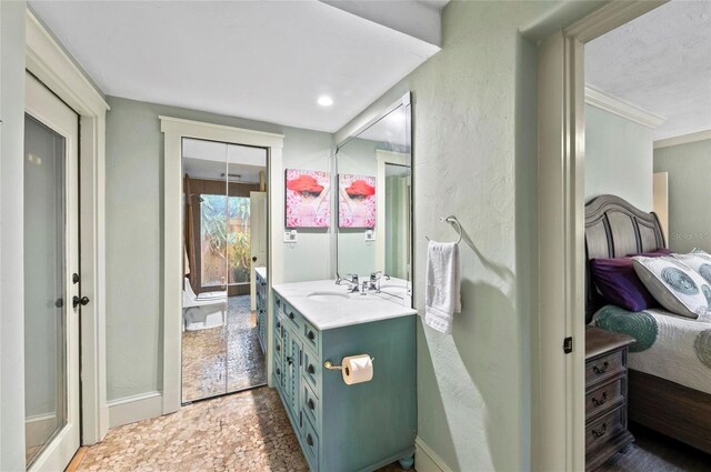 941 Virginia Dr, Sarasota, FL 34234 - ensuite bathroom featuring vanity and baseboards