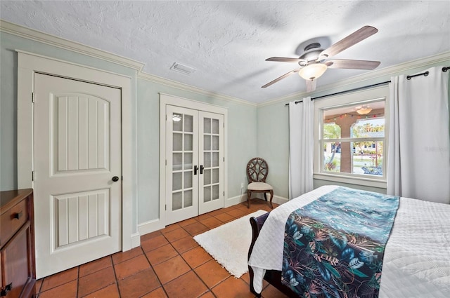 941 Virginia Dr, Sarasota, FL 34234 - tiled bedroom with french doors, crown molding, a textured ceiling, and a ceiling fan