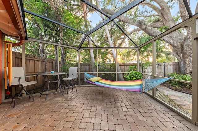 941 Virginia Dr, Sarasota, FL 34234 - view of patio featuring a fenced backyard and glass enclosure