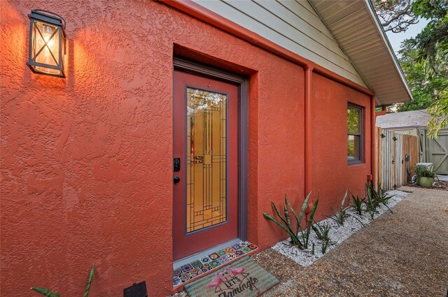 941 Virginia Dr, Sarasota, FL 34234 - property entrance featuring stucco siding and fence