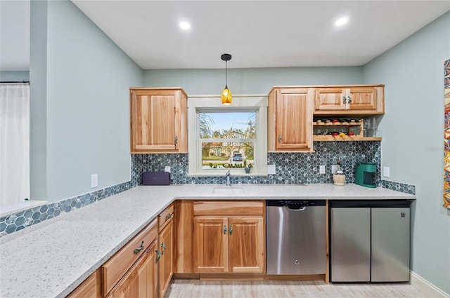 941 Virginia Dr, Sarasota, FL 34234 - kitchen with stainless steel dishwasher, tasteful backsplash, a sink, pendant lighting, and recessed lighting