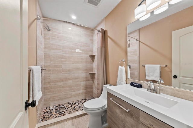941 Virginia Dr, Sarasota, FL 34234 - full bathroom featuring tiled shower, toilet, and vanity