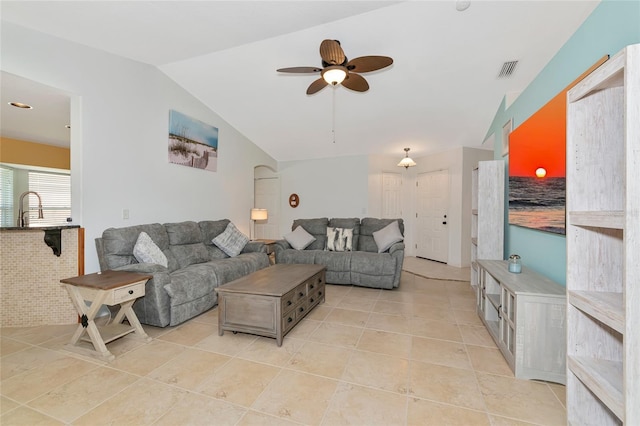 living area featuring light tile patterned floors, ceiling fan, and lofted ceiling