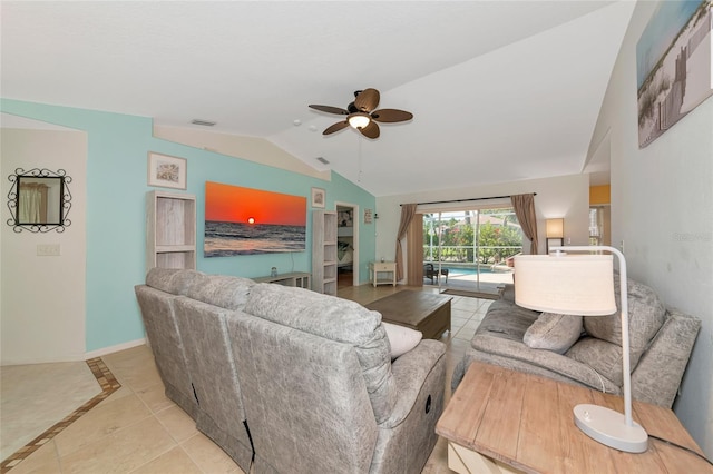 living room with lofted ceiling, light tile patterned flooring, ceiling fan, and baseboards