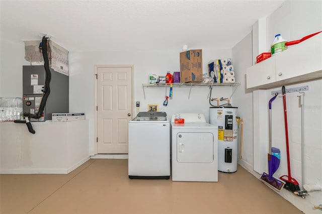 laundry area with water heater, washing machine and dryer, cabinet space, and heating unit