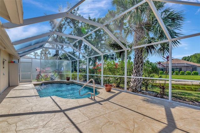 swimming pool with a patio and a lanai