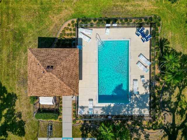 view of subject property with a pool area