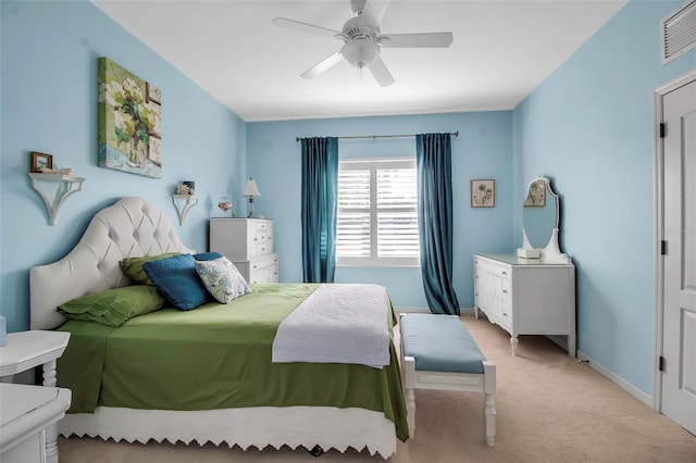 carpeted bedroom with baseboards and a ceiling fan