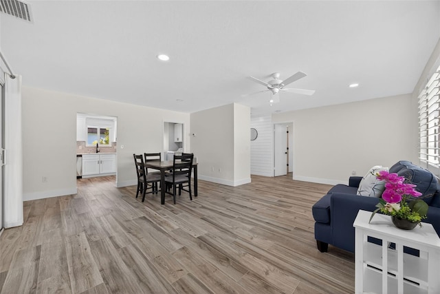 2733 Riverbluff Pl Unit V57, Sarasota, FL 34231 - living area with light wood-style flooring, a ceiling fan, recessed lighting, and healthy amount of natural light
