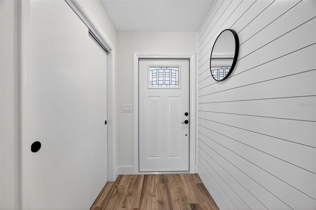 2733 Riverbluff Pl Unit V57, Sarasota, FL 34231 - entryway with wood walls and wood finished floors