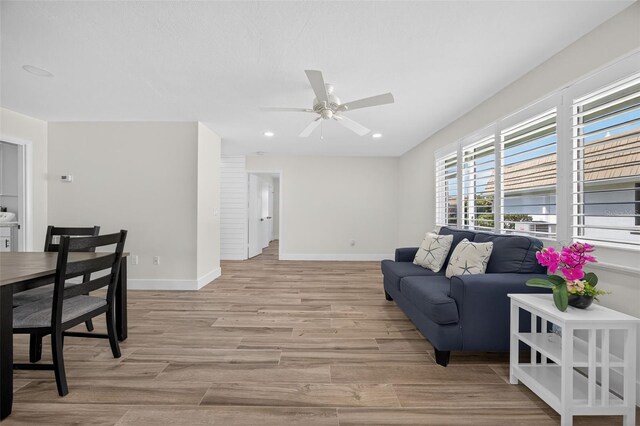 2733 Riverbluff Pl Unit V57, Sarasota, FL 34231 - living room with light wood finished floors, a ceiling fan, recessed lighting, and washer / dryer