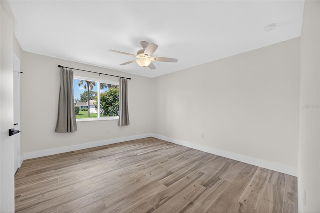 2733 Riverbluff Pl Unit V57, Sarasota, FL 34231 - unfurnished room featuring light wood-style flooring and a ceiling fan