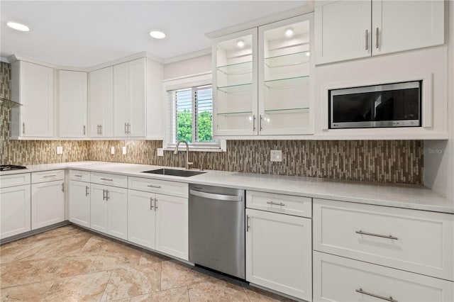 911 Cimarron Cir, Bradenton, FL 34209 - kitchen with stainless steel appliances, light countertops, backsplash, white cabinetry, and recessed lighting