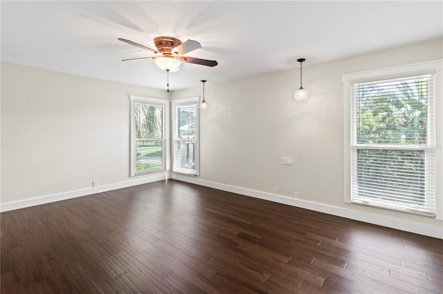 911 Cimarron Cir, Bradenton, FL 34209 - empty room featuring a ceiling fan, plenty of natural light, and dark wood-style flooring
