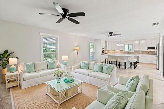 911 Cimarron Cir, Bradenton, FL 34209 - living room with ceiling fan, plenty of natural light, and recessed lighting