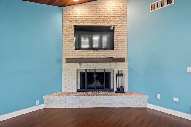 911 Cimarron Cir, Bradenton, FL 34209 - unfurnished living room featuring a fireplace, wood finished floors, and wooden ceiling