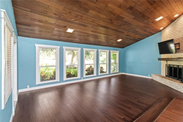 911 Cimarron Cir, Bradenton, FL 34209 - unfurnished living room featuring vaulted ceiling, plenty of natural light, a fireplace, wooden ceiling, and wood finished floors