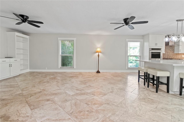 911 Cimarron Cir, Bradenton, FL 34209 - living area with healthy amount of natural light and ceiling fan