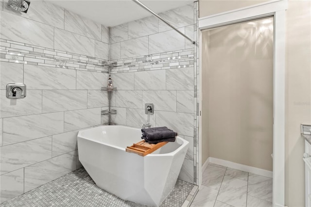 911 Cimarron Cir, Bradenton, FL 34209 - full bath featuring a soaking tub, marble look tile flooring, and tiled shower