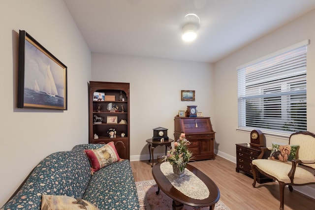 sitting room featuring light wood-style flooring and baseboards