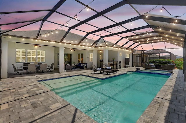 13918 Old Creek Ct, Parrish, FL 34219 - view of pool with a patio, ceiling fan, outdoor dining area, a pool with connected hot tub, and glass enclosure