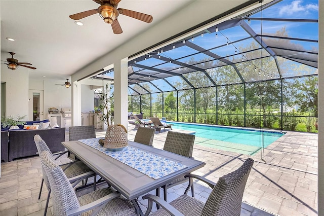 13918 Old Creek Ct, Parrish, FL 34219 - view of patio with ceiling fan, exterior kitchen, outdoor dining space, an outdoor living space, and an outdoor pool