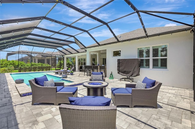 13918 Old Creek Ct, Parrish, FL 34219 - view of patio / terrace featuring an outdoor living space with a fire pit, an outdoor pool, and a lanai