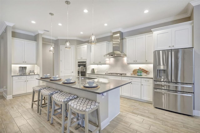 13918 Old Creek Ct, Parrish, FL 34219 - kitchen with appliances with stainless steel finishes, wall chimney range hood, wood finish floors, a sink, and decorative backsplash