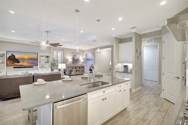 13918 Old Creek Ct, Parrish, FL 34219 - kitchen featuring dishwasher, a sink, open floor plan, ceiling fan, and a center island with sink