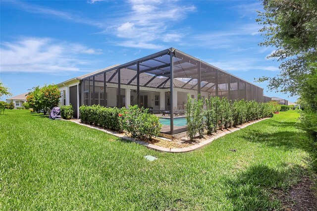 13918 Old Creek Ct, Parrish, FL 34219 - rear view of house featuring a yard, an outdoor pool, and glass enclosure