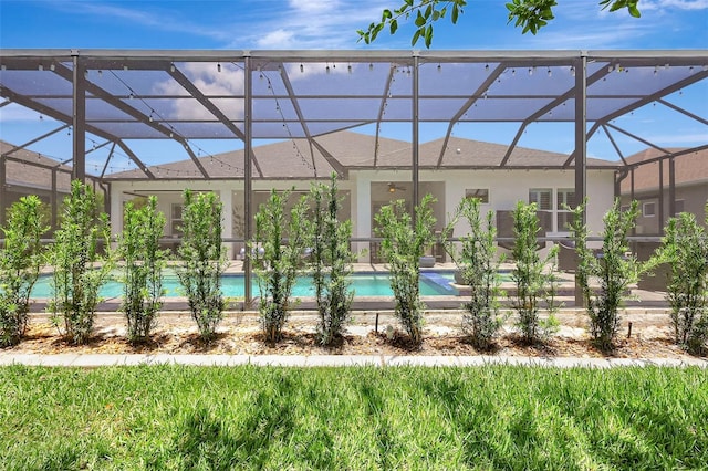13918 Old Creek Ct, Parrish, FL 34219 - swimming pool featuring glass enclosure and a ceiling fan