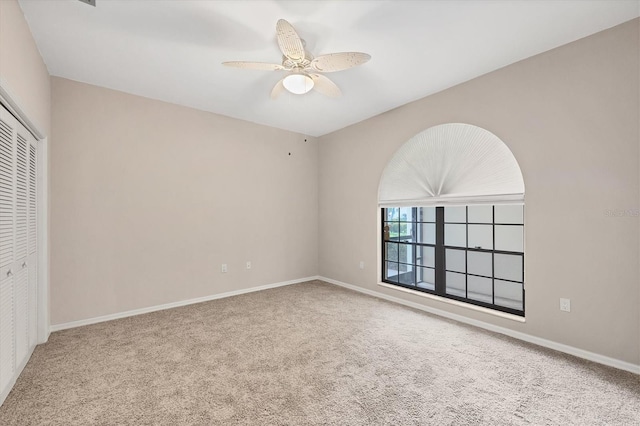 4517 Las Brisas Ln, Sarasota, FL 34238 - unfurnished bedroom featuring carpet flooring, a closet, baseboards, and a ceiling fan