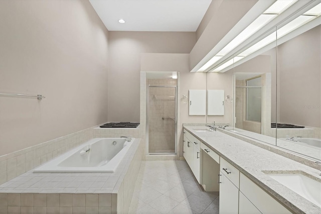 4517 Las Brisas Ln, Sarasota, FL 34238 - bathroom with double vanity, a shower stall, tile patterned floors, and a bath