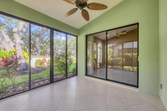 4517 Las Brisas Ln, Sarasota, FL 34238 - tiled empty room featuring lofted ceiling and ceiling fan