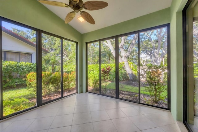 4517 Las Brisas Ln, Sarasota, FL 34238 - unfurnished sunroom featuring vaulted ceiling and tile patterned flooring