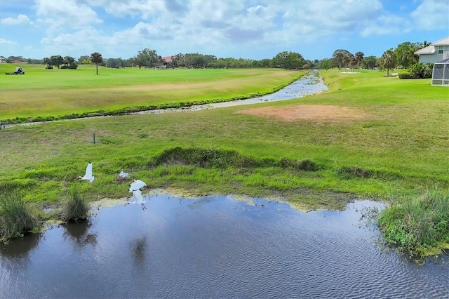 4517 Las Brisas Ln, Sarasota, FL 34238 - view of property's community featuring golf course view, a lawn, and a water view