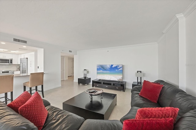 living area with crown molding