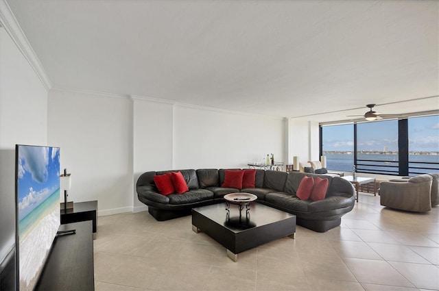 living area featuring crown molding, a water view, light tile patterned floors, a ceiling fan, and a wall of windows
