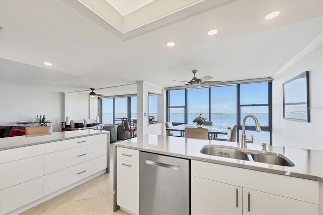 kitchen featuring dishwasher, a sink, ceiling fan, light countertops, and ornamental molding