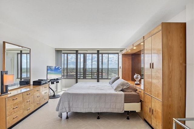 bedroom with light tile patterned flooring