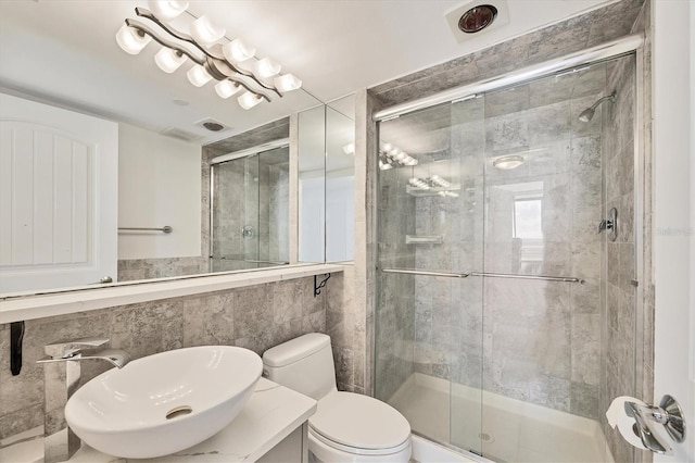 full bath with a shower stall, toilet, and vanity
