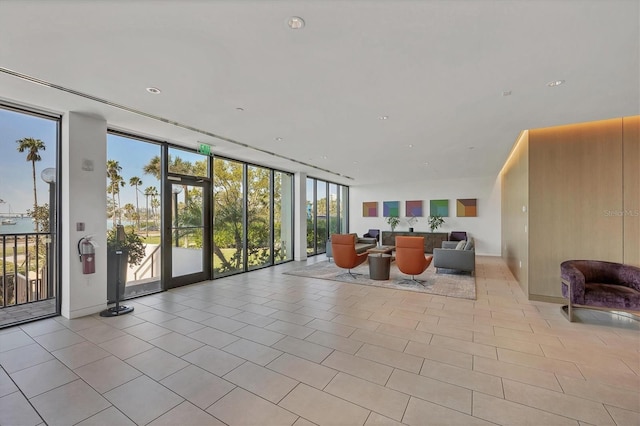 building lobby with floor to ceiling windows and recessed lighting