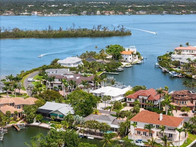 aerial perspective of suburban area featuring a nearby body of water